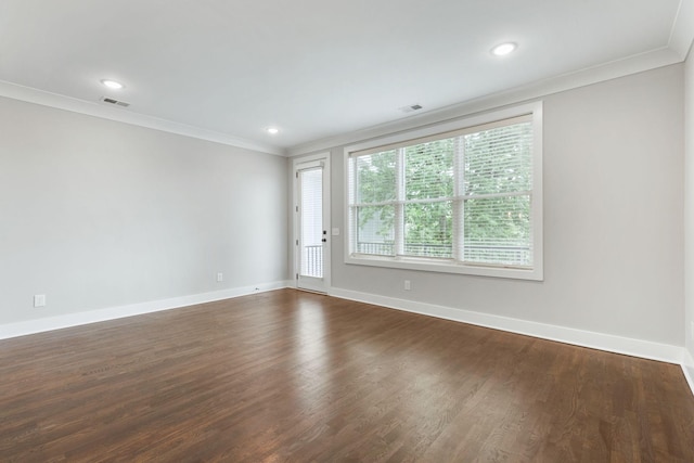 unfurnished room with visible vents, crown molding, and baseboards