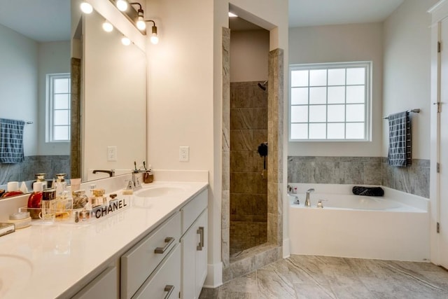 bathroom featuring tiled shower, a sink, a bath, and double vanity