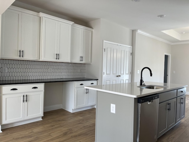 kitchen with a sink, a center island with sink, white cabinetry, and dishwasher