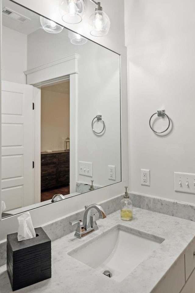 bathroom with visible vents and vanity