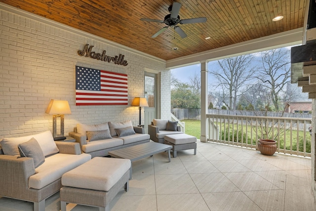 sunroom / solarium with wooden ceiling and ceiling fan