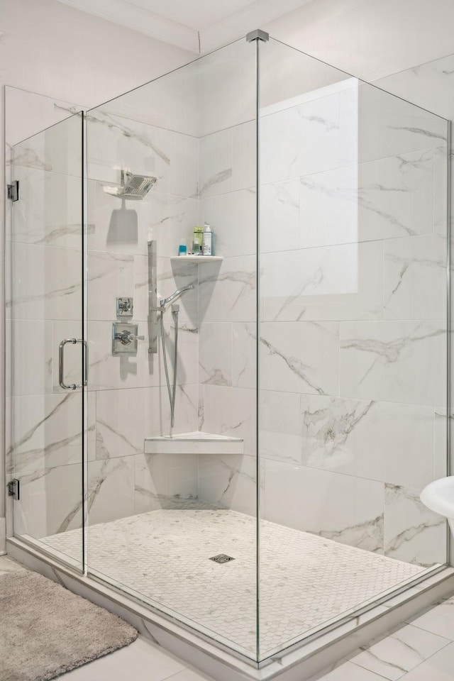 bathroom with marble finish floor and a marble finish shower