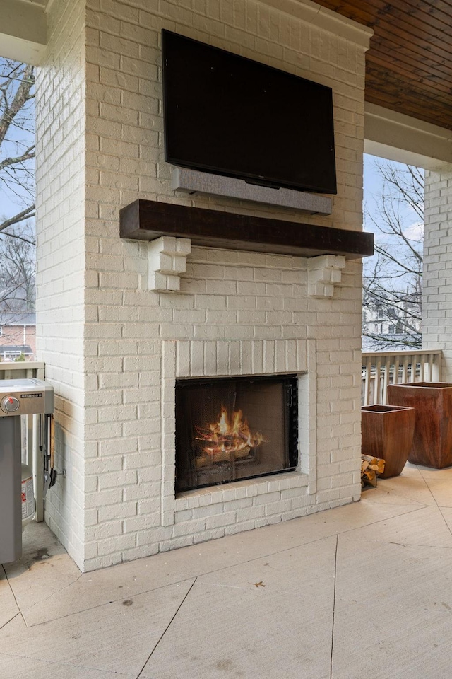 details with an outdoor brick fireplace