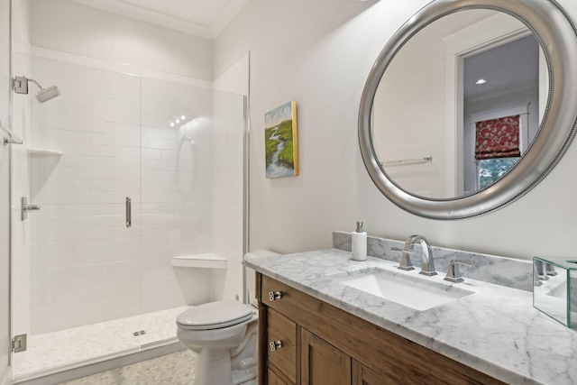 full bath featuring toilet, a shower stall, and vanity