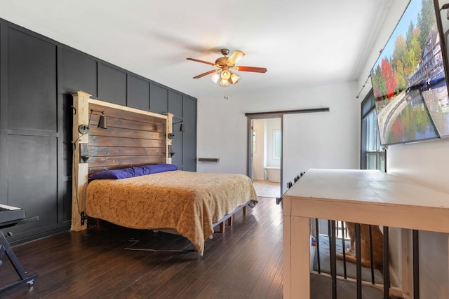 bedroom featuring dark wood-style floors and ceiling fan