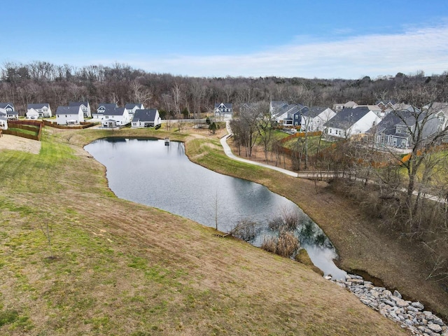 drone / aerial view with a residential view and a water view