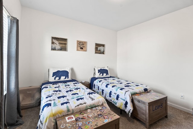 bedroom featuring carpet and baseboards