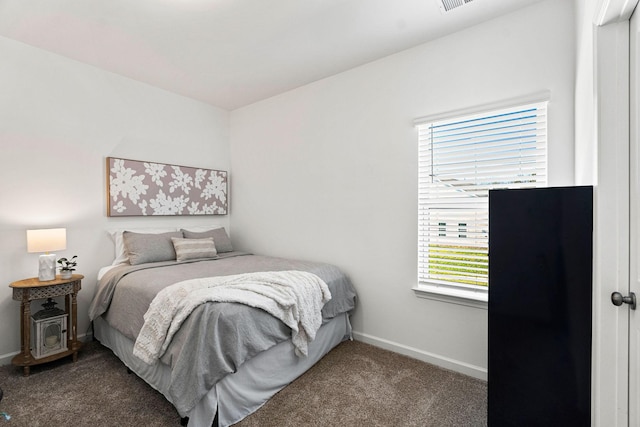 carpeted bedroom featuring visible vents and baseboards