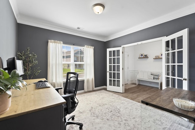 home office featuring ornamental molding, french doors, visible vents, and wood finished floors