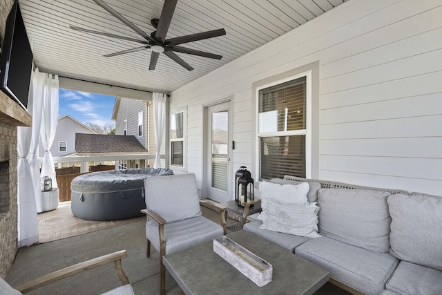 view of patio with an outdoor hangout area, a ceiling fan, and a hot tub