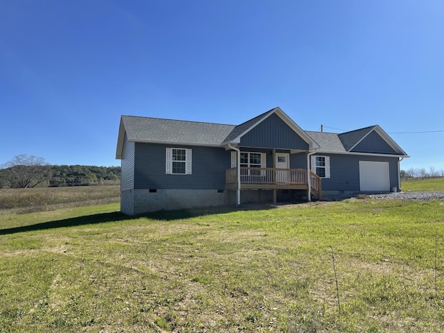 view of front of home featuring crawl space, an attached garage, and a front yard