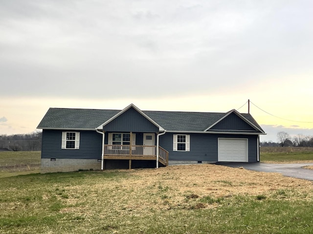 ranch-style house with a front lawn, driveway, an attached garage, a shingled roof, and crawl space