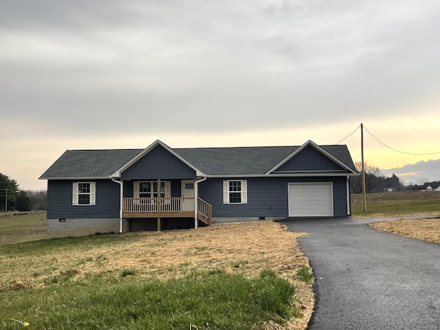 ranch-style home with crawl space, aphalt driveway, an attached garage, and a shingled roof