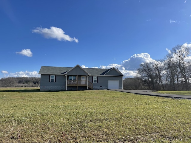 single story home featuring driveway, crawl space, an attached garage, and a front yard