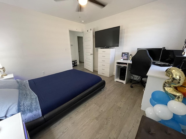 bedroom featuring ceiling fan and wood finished floors