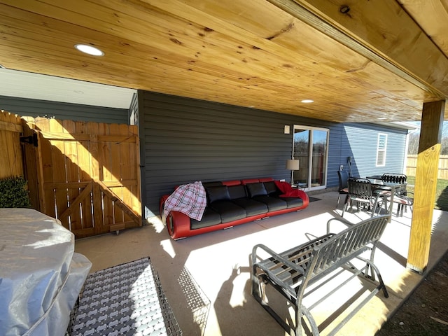 view of patio featuring outdoor dining area and fence