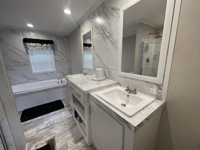 full bathroom featuring decorative backsplash, a bath, vanity, a shower stall, and tile walls