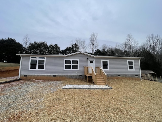 back of house with crawl space