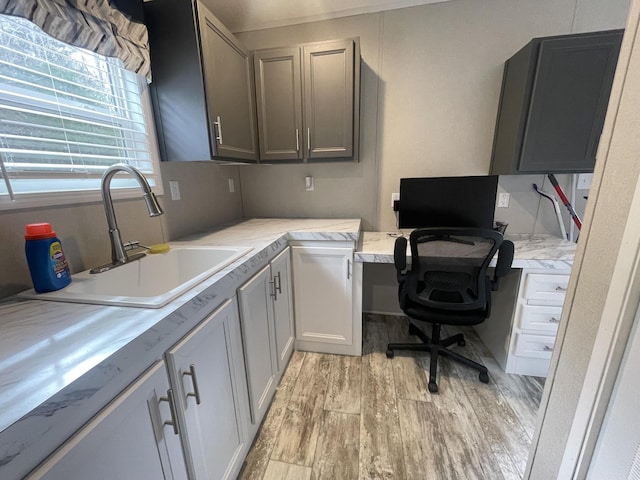 office featuring a sink and light wood-style floors