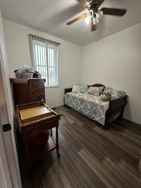 bedroom featuring dark wood-style floors and a ceiling fan