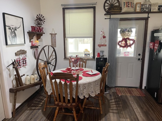 dining room featuring dark wood-style flooring