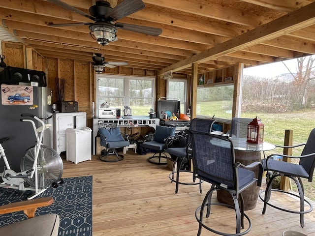 sunroom / solarium with ceiling fan