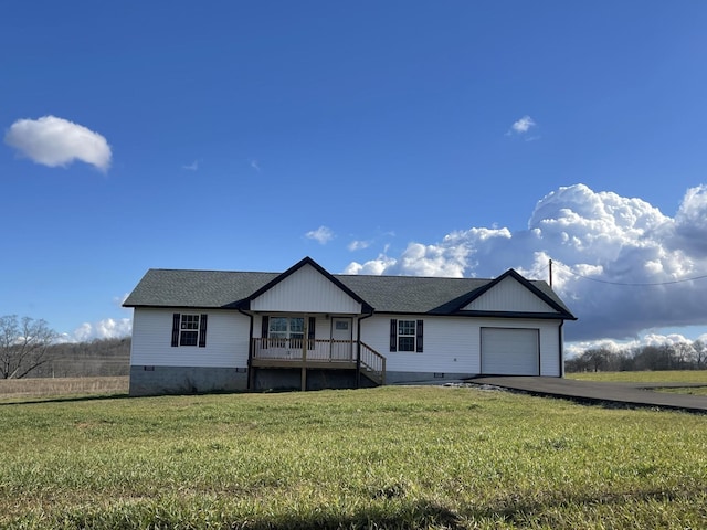 view of front of home with crawl space, covered porch, an attached garage, and a front yard