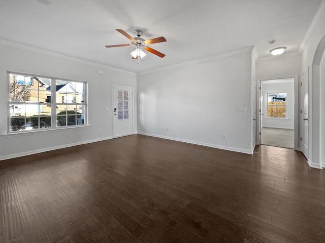 unfurnished living room with baseboards, dark wood-style flooring, and crown molding