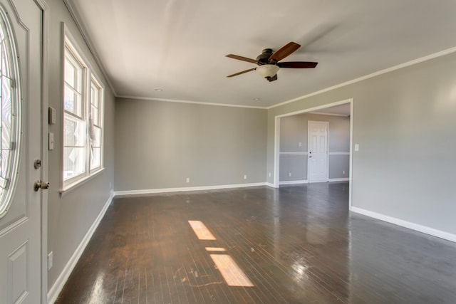 spare room featuring a ceiling fan, crown molding, baseboards, and dark wood-type flooring