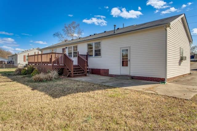 back of house with a yard, fence, a patio, and a wooden deck