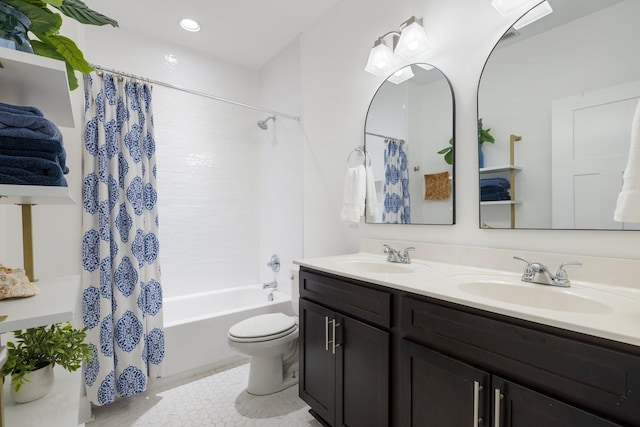 full bathroom with shower / bath combo, a sink, toilet, and double vanity