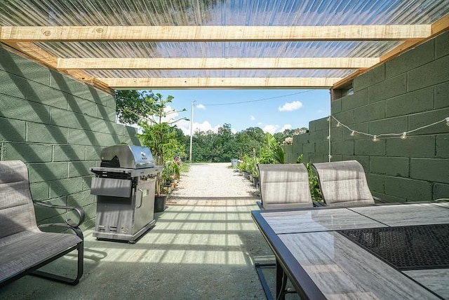 view of patio with outdoor dining area and area for grilling