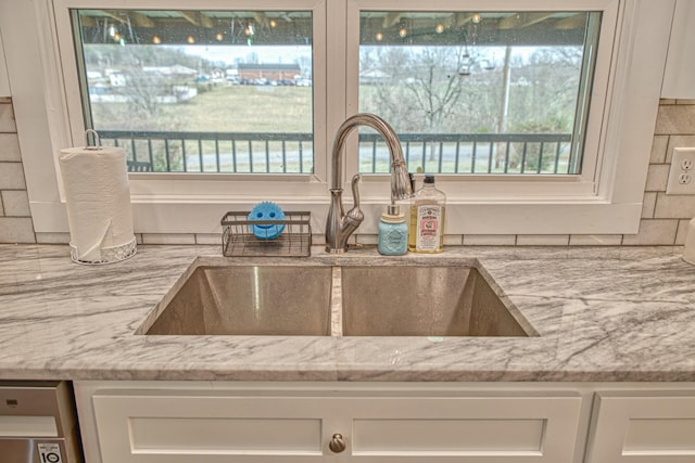 23 Hickman Hwy, Gordonsville, TN 38563 - details with light stone counters, a sink, and white cabinets
