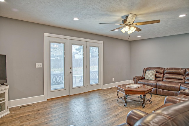 23 Hickman Hwy, Gordonsville, TN 38563 - living area with baseboards, wood finished floors, and french doors