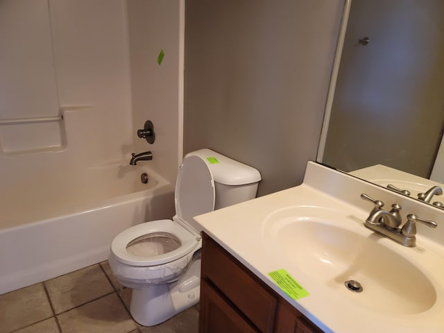 full bath featuring bathing tub / shower combination, vanity, toilet, and tile patterned floors