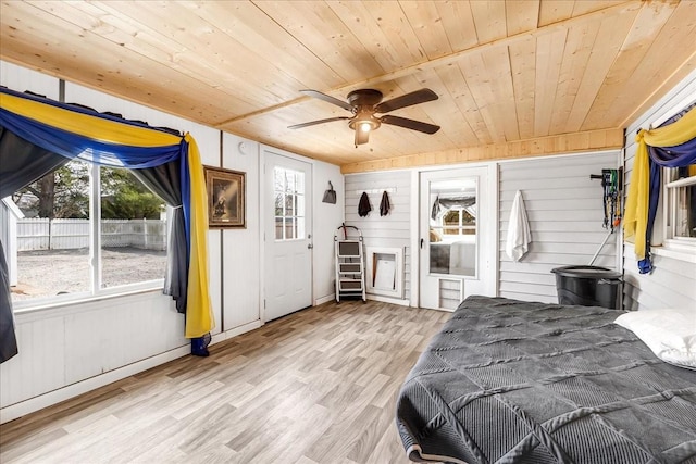 unfurnished bedroom with a ceiling fan, wooden ceiling, and light wood finished floors