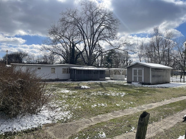 view of yard with a storage shed and an outdoor structure