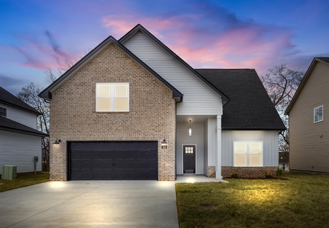 traditional home featuring brick siding, a shingled roof, central AC unit, concrete driveway, and a front yard