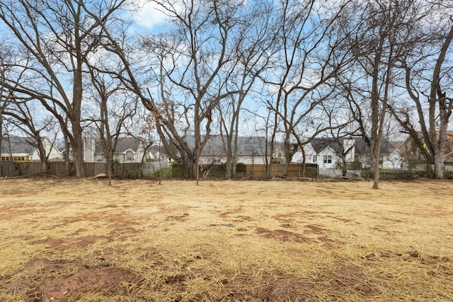 view of yard with fence and a residential view