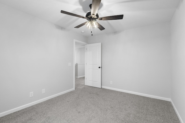 unfurnished bedroom with a ceiling fan, carpet flooring, and baseboards