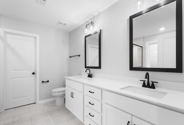 full bath with double vanity, a sink, and visible vents