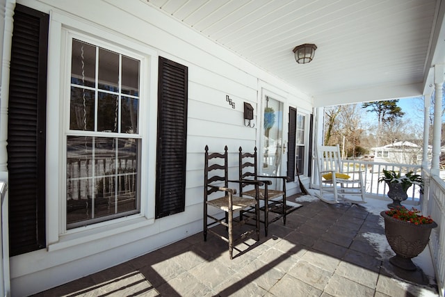 view of patio featuring a porch