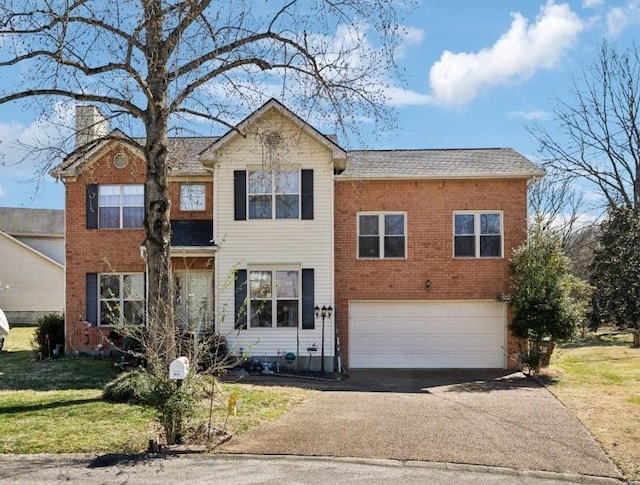 traditional-style home featuring aphalt driveway, a front yard, a chimney, and a garage