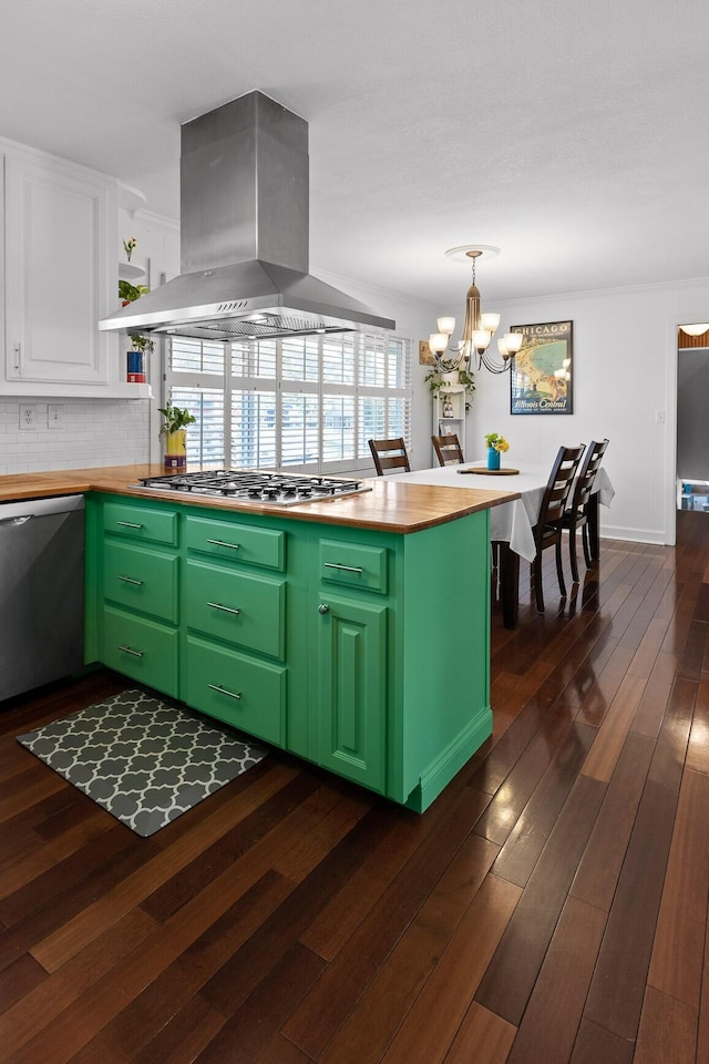 kitchen featuring island range hood, white cabinets, appliances with stainless steel finishes, dark wood-type flooring, and green cabinets