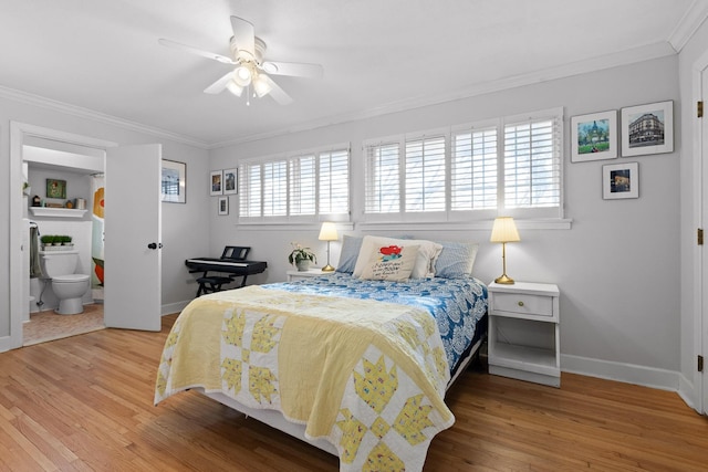 bedroom featuring ensuite bathroom, ceiling fan, wood finished floors, baseboards, and ornamental molding