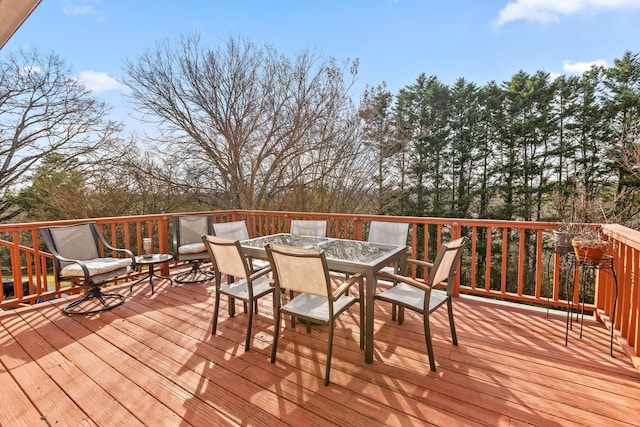 wooden deck featuring outdoor dining space