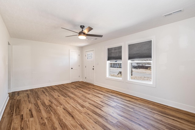 1100 S Russell St, Portland, TN 37148 - spare room featuring wood finished floors and a ceiling fan