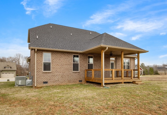 rear view of house featuring crawl space, roof with shingles, brick siding, and central air condition unit