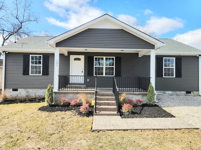 view of front of property featuring crawl space, a shingled roof, and a porch