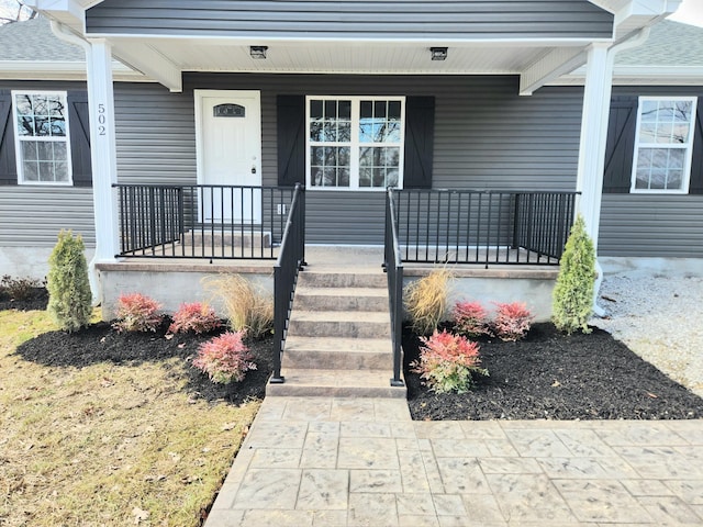 entrance to property with a porch